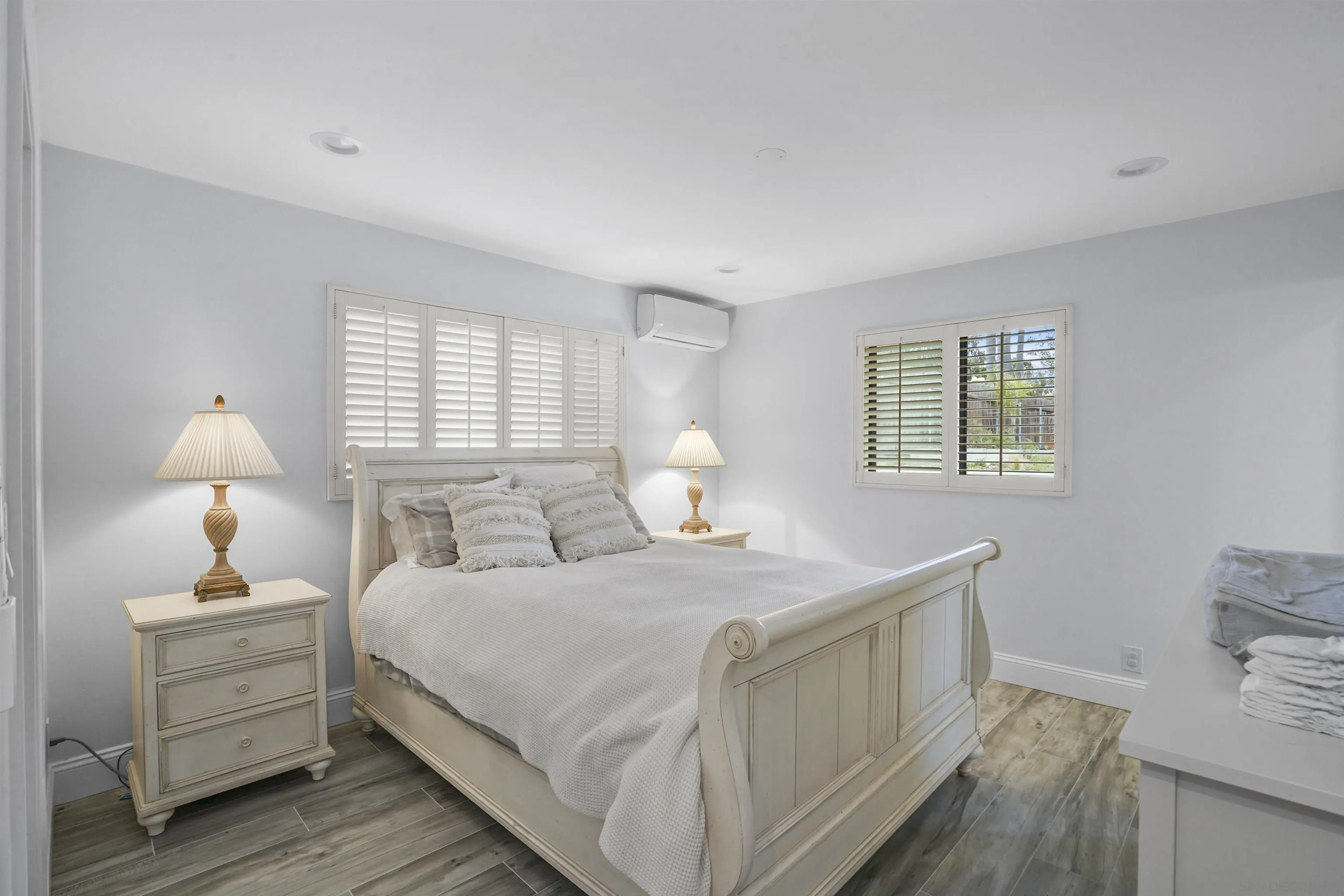 1235 Blue Sky Drive Cardiff, CA 92007 - Photo 15 of 35 a bedroom with a bed and a lamp