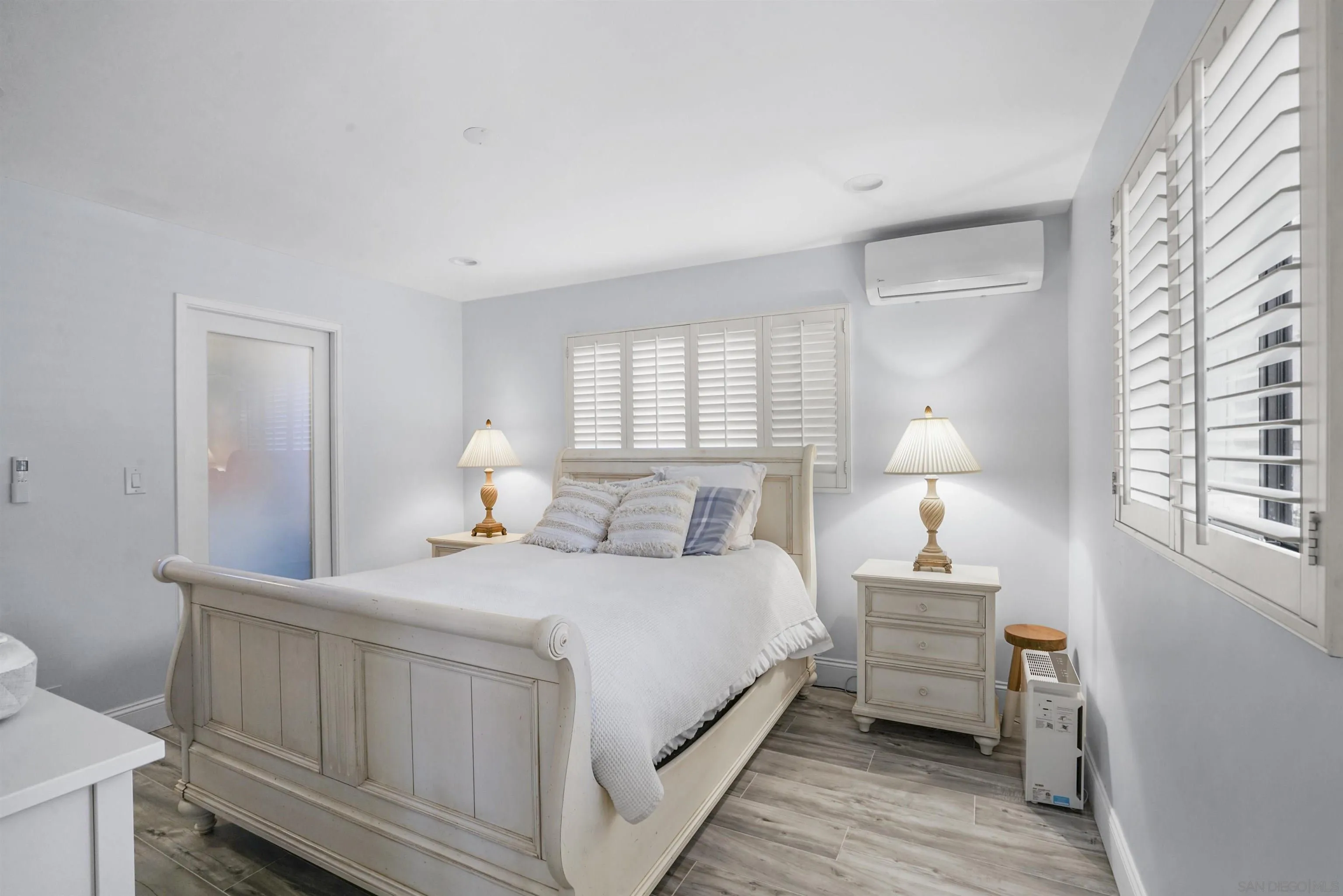 1235 Blue Sky Drive Cardiff, CA 92007 - Photo 16 of 35 a bedroom with a bed and a lamp