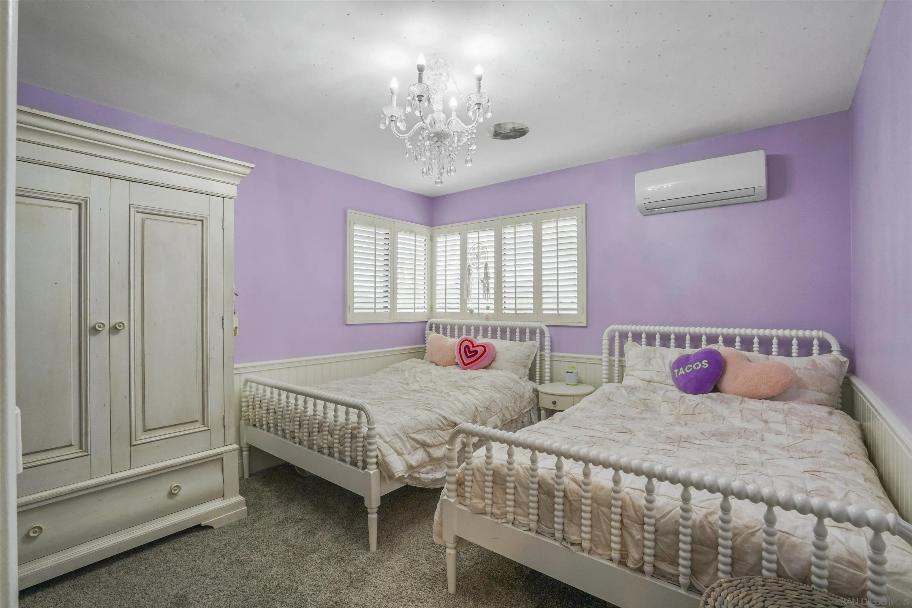 1235 Blue Sky Drive Cardiff, CA 92007 - Photo 20 of 35 a bedroom with two beds and a chandelier