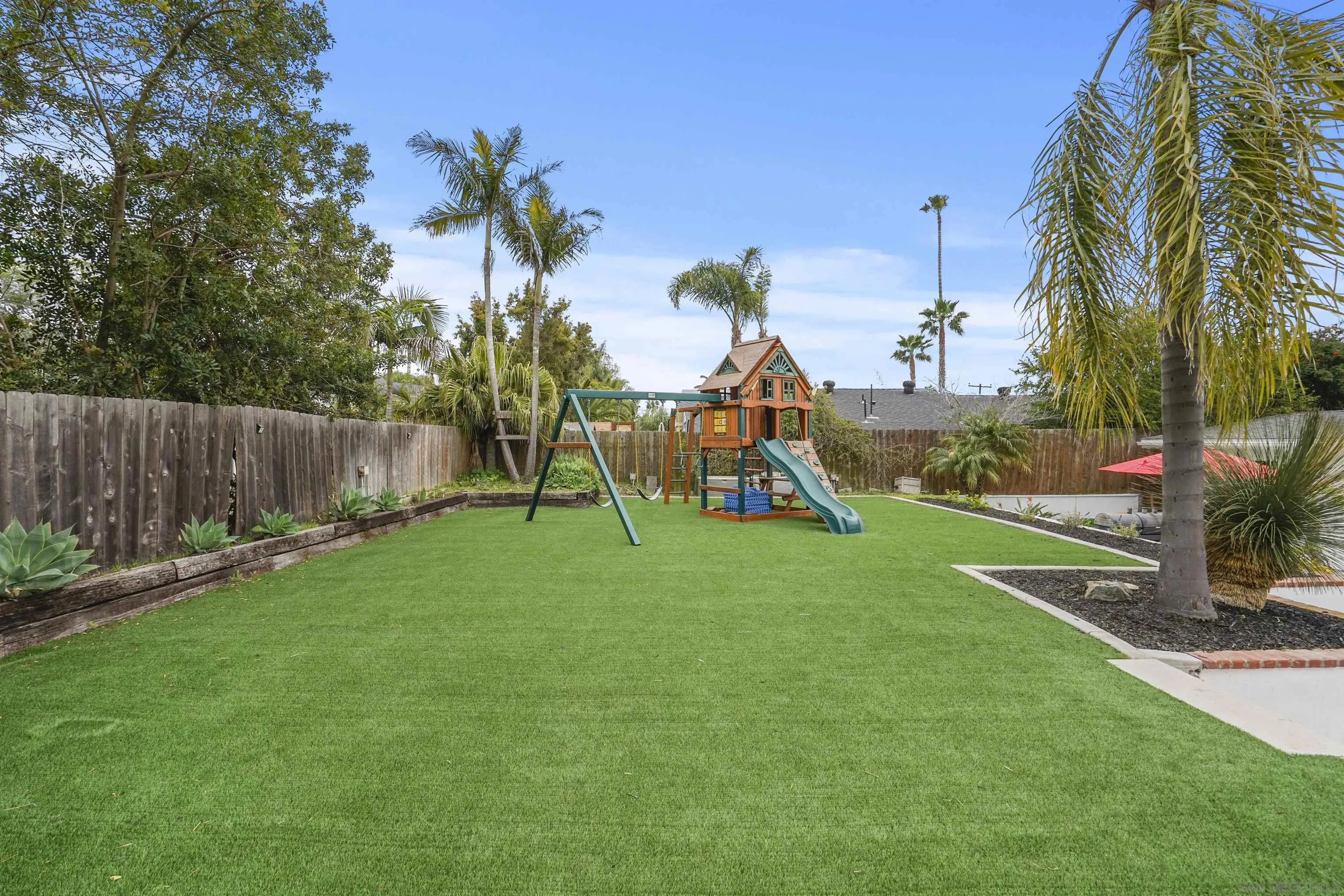 1235 Blue Sky Drive Cardiff, CA 92007 - Photo 23 of 35 a view of a park with swings and slides