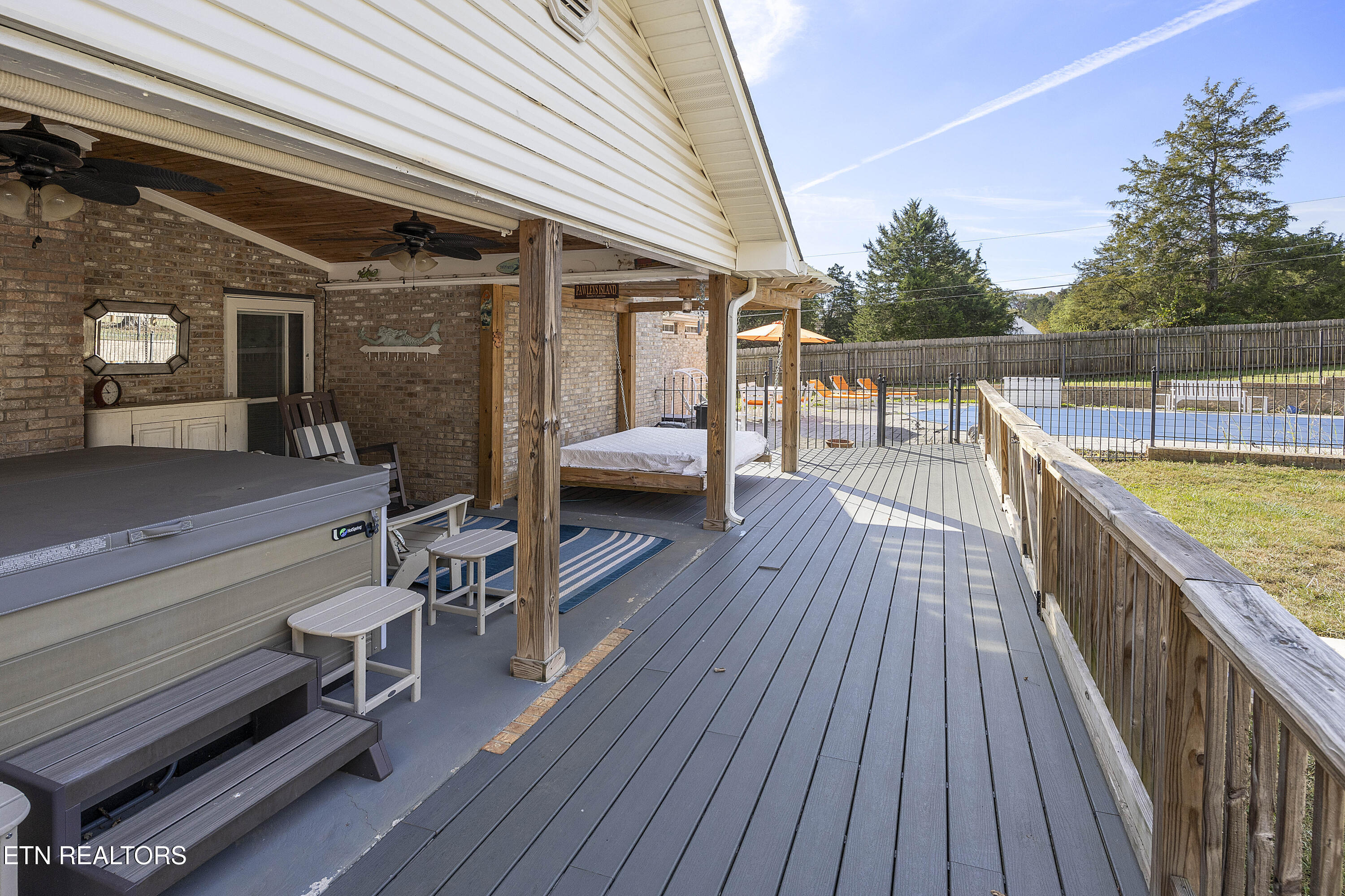 5829 Maloneyville Road Corryton, TN 37721 - Photo 31 of 44 Hot tub and swinging bed