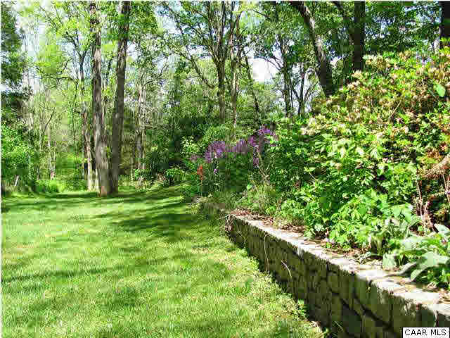 3406 Keswick Road Keswick, VA 22947 - Photo 13 of 28 a backyard of a house with lots of swings