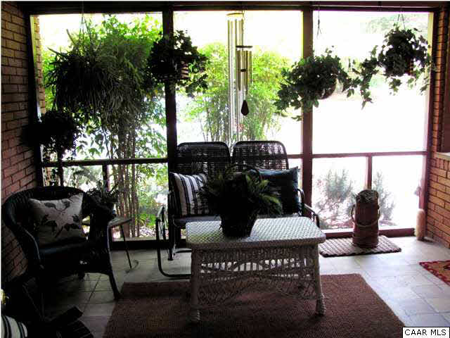 3406 Keswick Road Keswick, VA 22947 - Photo 19 of 28 a view of a chairs and table in the patio