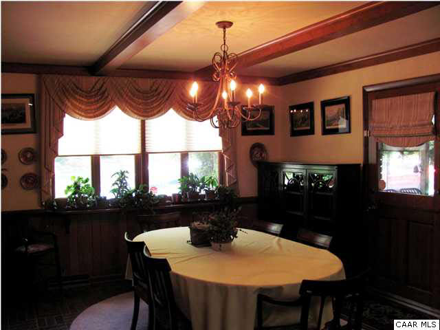 3406 Keswick Road Keswick, VA 22947 - Photo 22 of 28 a view of a dining room with furniture window and wooden floor