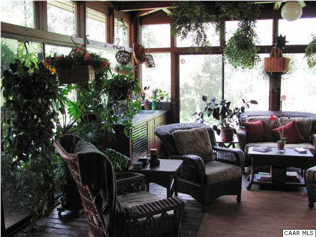 3406 Keswick Road Keswick, VA 22947 - Photo 26 of 28 a living room with furniture and a floor to ceiling window