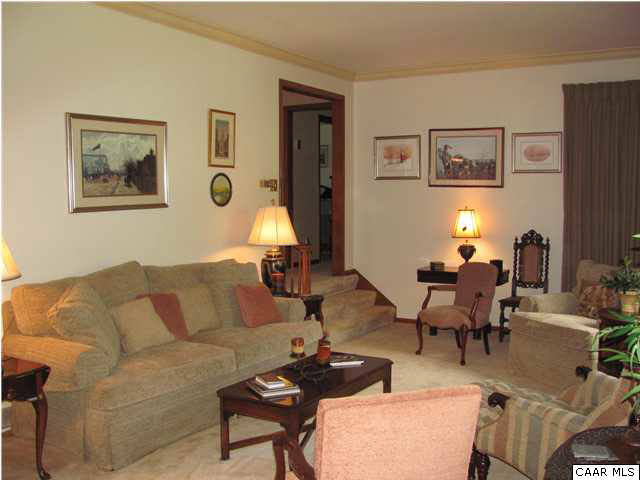 3406 Keswick Road Keswick, VA 22947 - Photo 27 of 28 a living room with furniture and a lamp