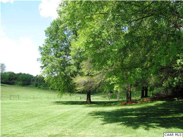 3406 Keswick Road Keswick, VA 22947 - Photo 3 of 28 a grassy field with a trees in the background