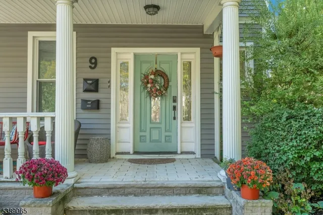 a front view of a house with outdoor seating