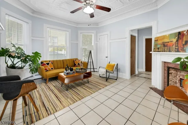 a living room with furniture and a fireplace