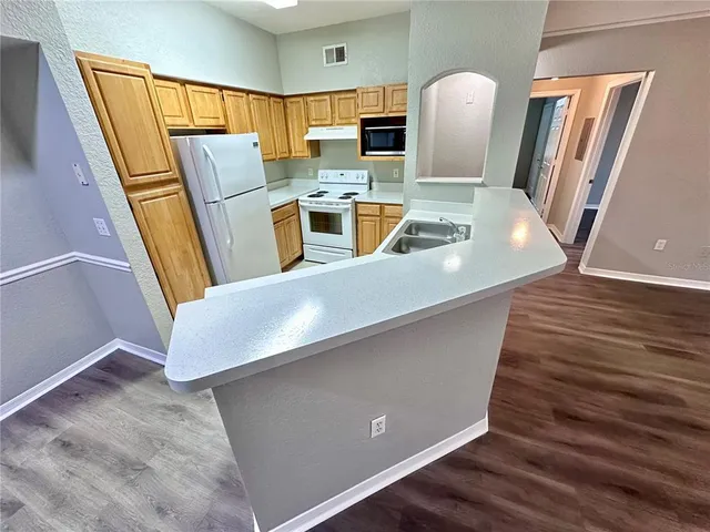 a view of a kitchen with a sink