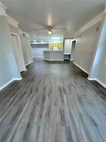 a view of a livingroom with a dishwasher and a window