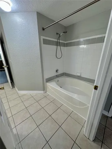 a bathroom with a sink mirror and vanity