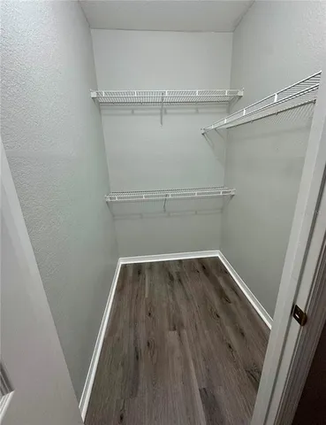 a bathroom with a double vanity sink mirror and toilet