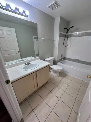 an empty room with wooden floor