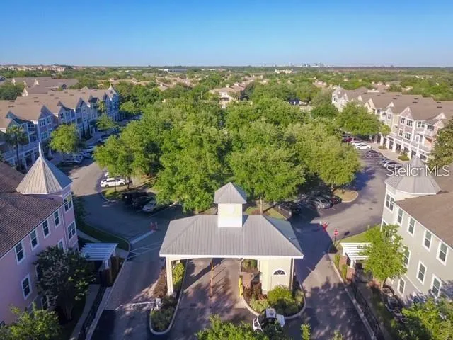 an aerial view of a house with yard swimming pool and outdoor seating