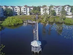 an aerial view of a house with a lake view