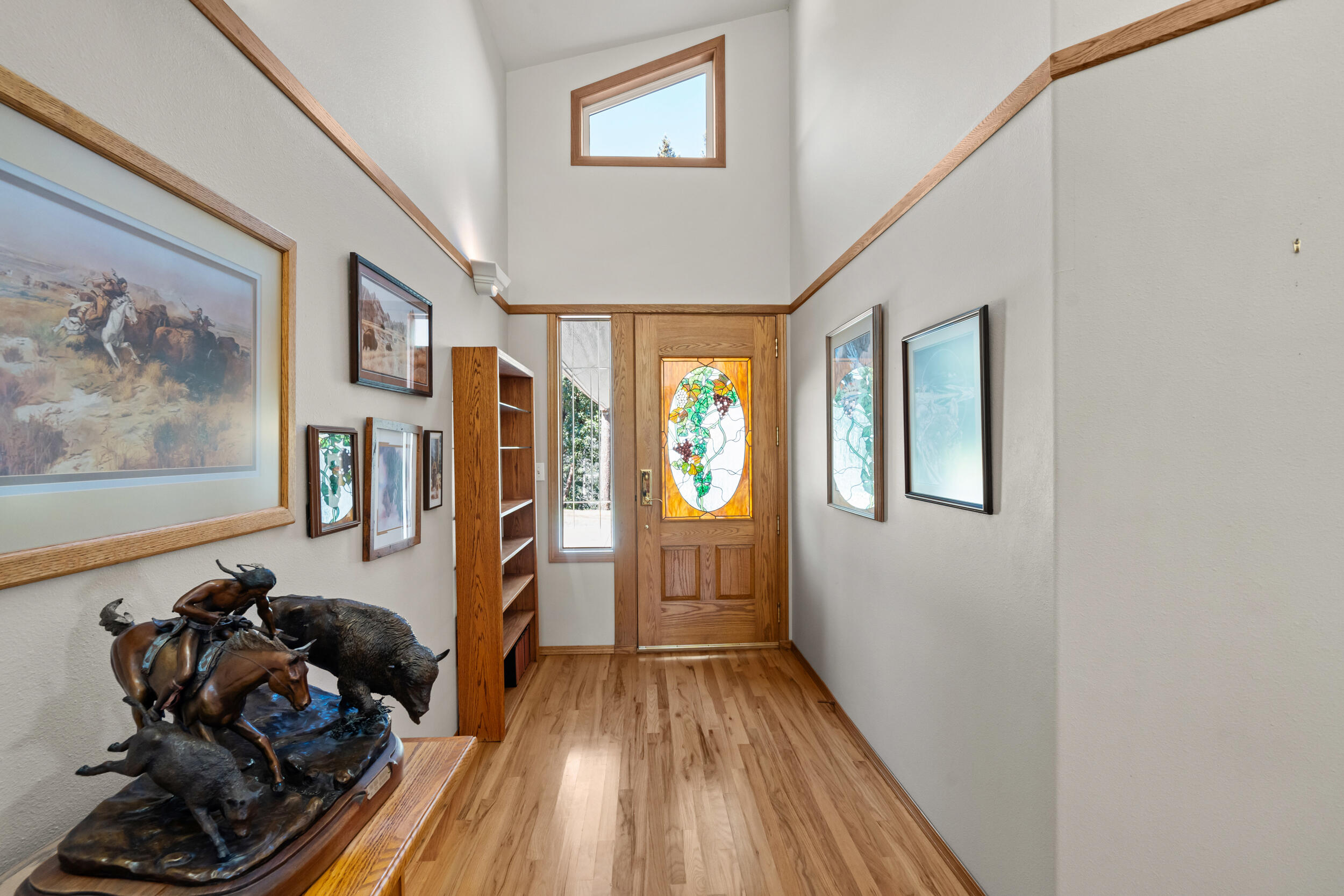 9302 Yank Gulch Road Talent, OR 97540 - Photo 12 of 37 a room with wooden floor and furniture