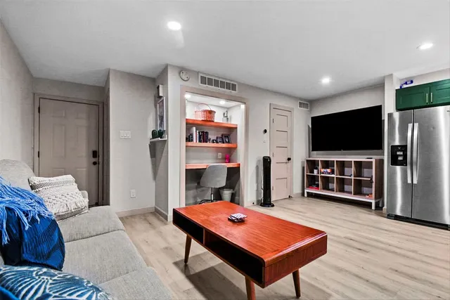 a room with furniture and a flat screen tv