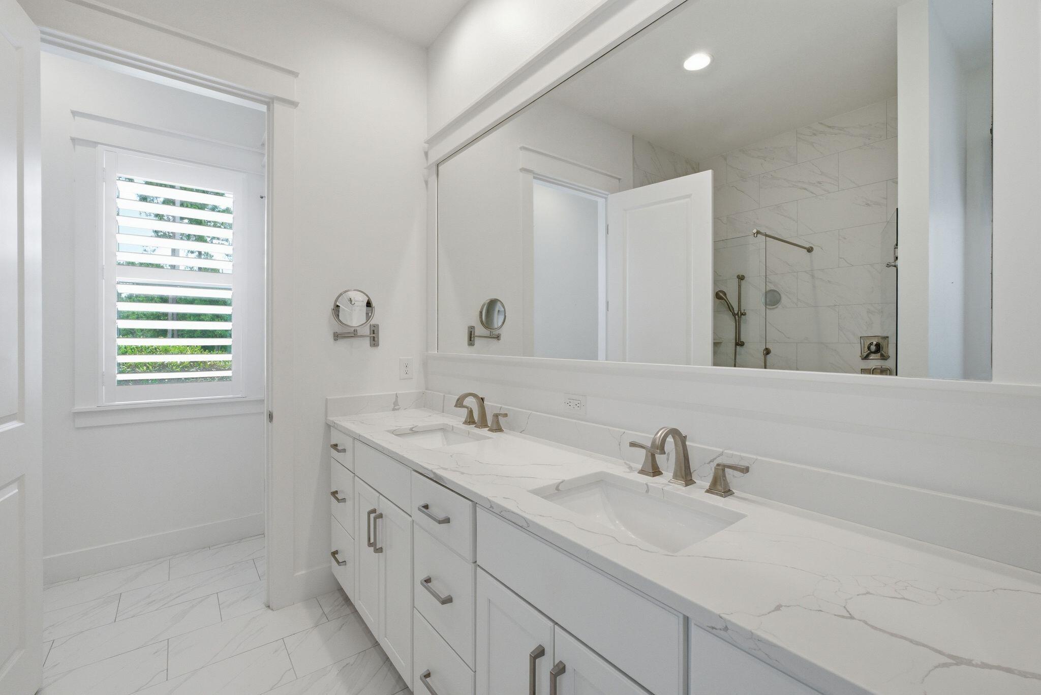 133 Sandchase Circle, Unit LOT 15 Inlet Beach, FL 32461 - Photo 16 of 47 a bathroom with double sink and a window