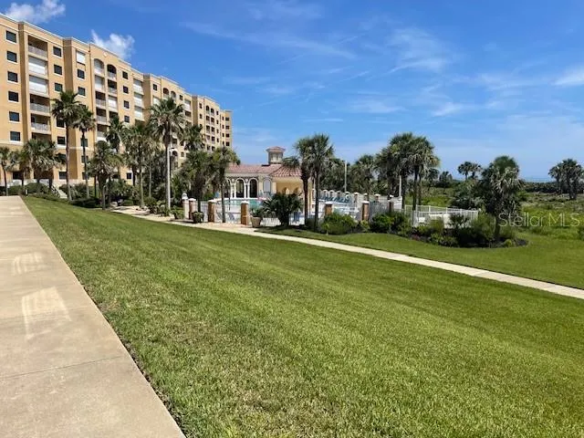 a view of a field with a building