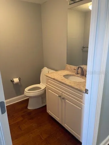 a view of hallway with wooden floor