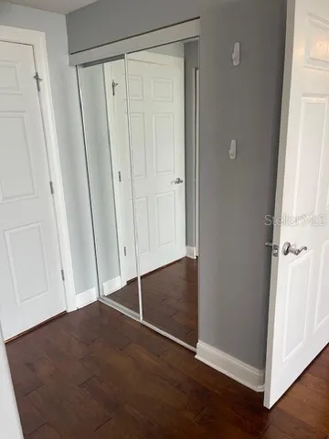 a large white bathroom with a sink a mirror and a shower