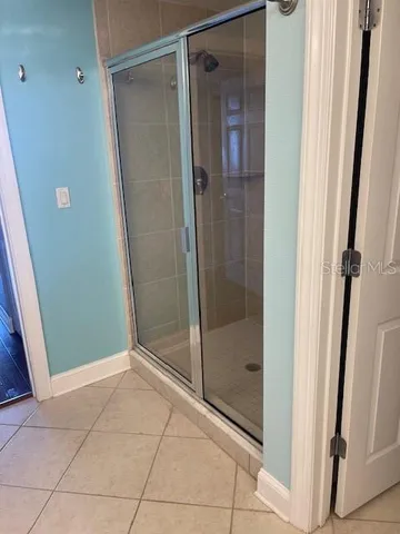 a bathroom with a granite countertop sink a toilet and a mirror