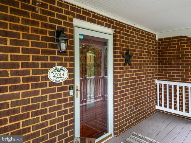 a view of a door with wooden floor