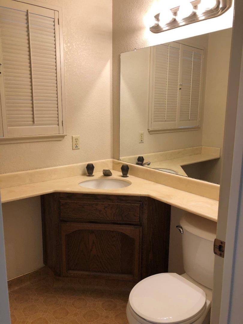23025 Voss Avenue Cupertino, CA 95014 - Photo 12 of 45 a bathroom with a sink vanity and toilet