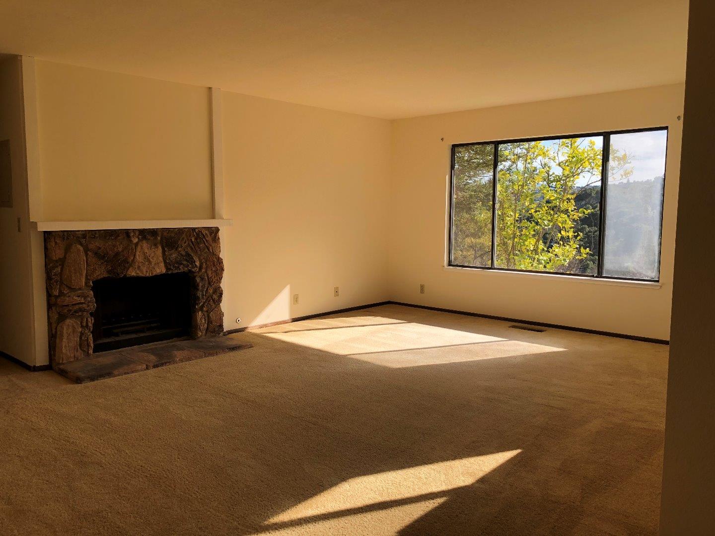 23025 Voss Avenue Cupertino, CA 95014 - Photo 17 of 45 a view of empty room with a fireplace