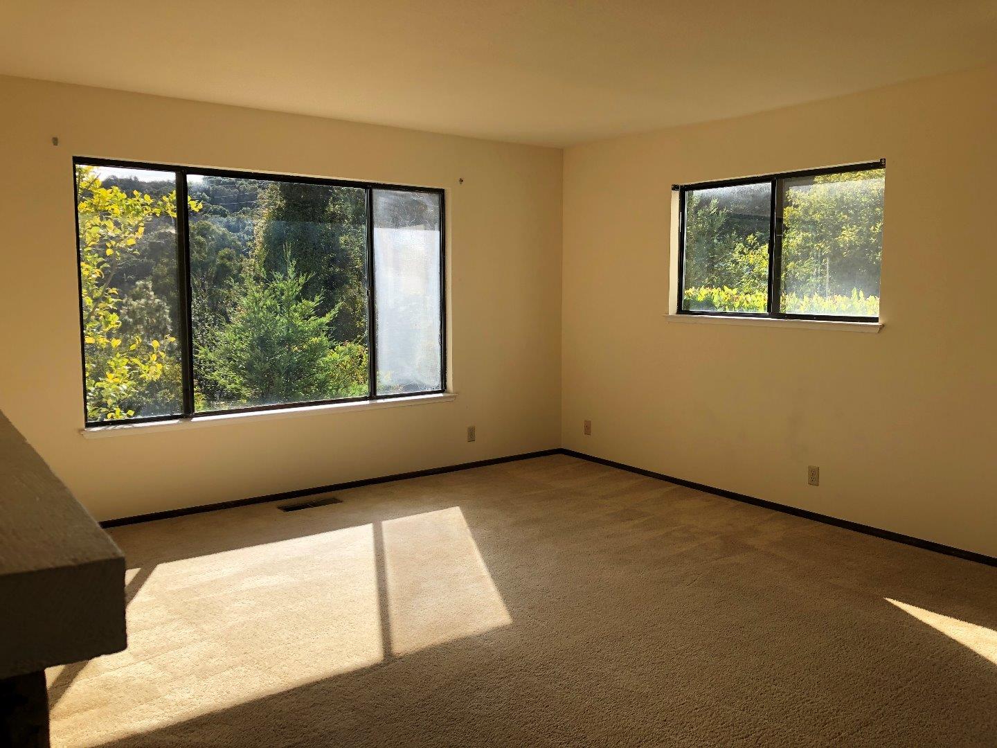 23025 Voss Avenue Cupertino, CA 95014 - Photo 18 of 45 an empty room with large windows