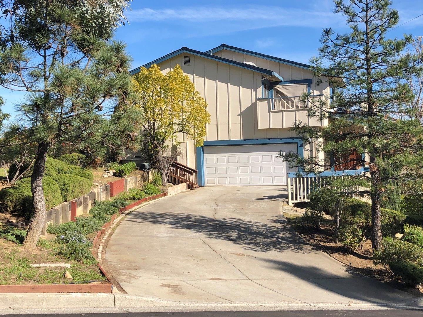 23025 Voss Avenue Cupertino, CA 95014 - Photo 2 of 45 a front view of a house with a yard