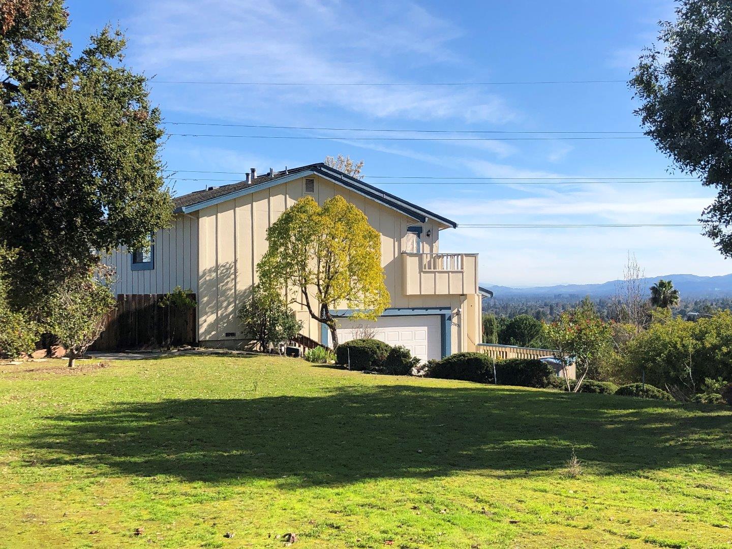 23025 Voss Avenue Cupertino, CA 95014 - Photo 3 of 45 a view of a house with a swimming pool