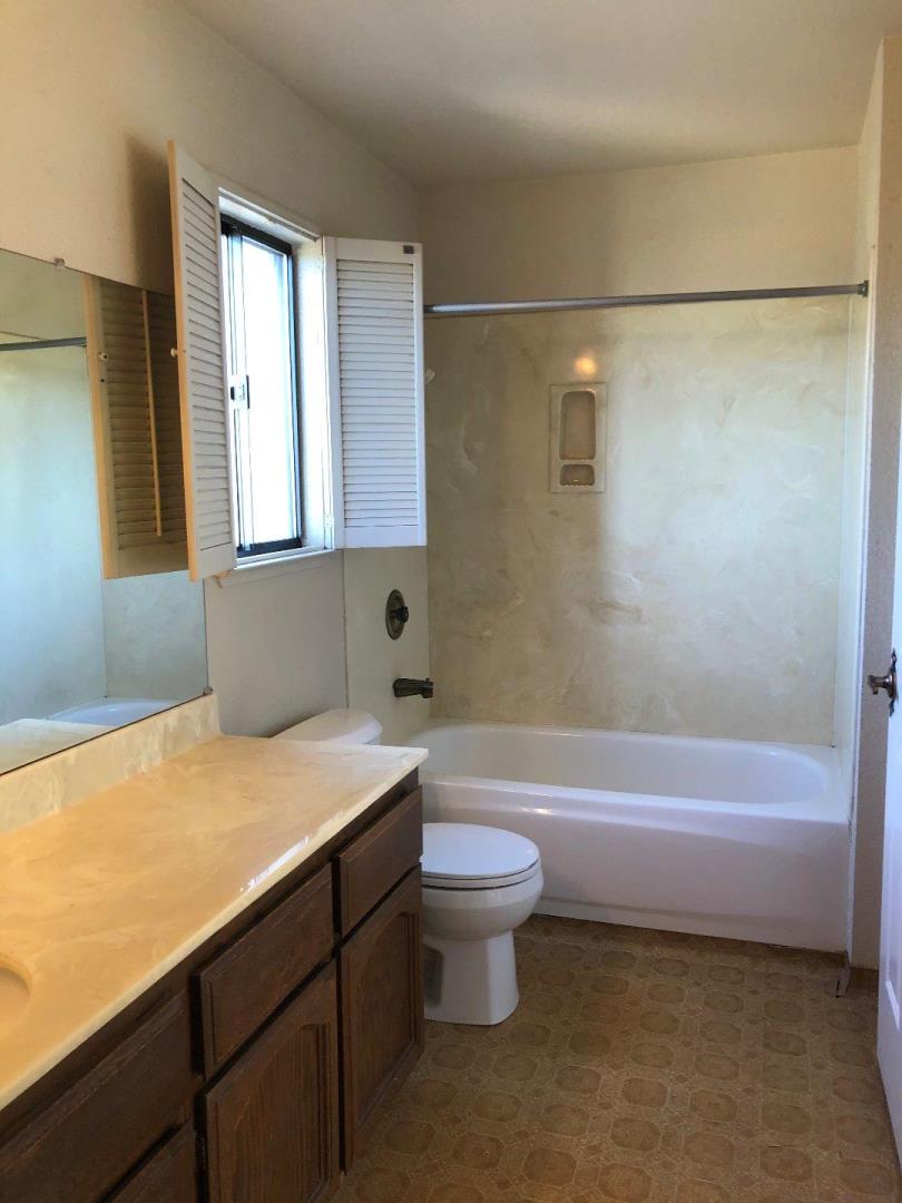 23025 Voss Avenue Cupertino, CA 95014 - Photo 33 of 45 a bathroom with a sink a toilet and bathtub
