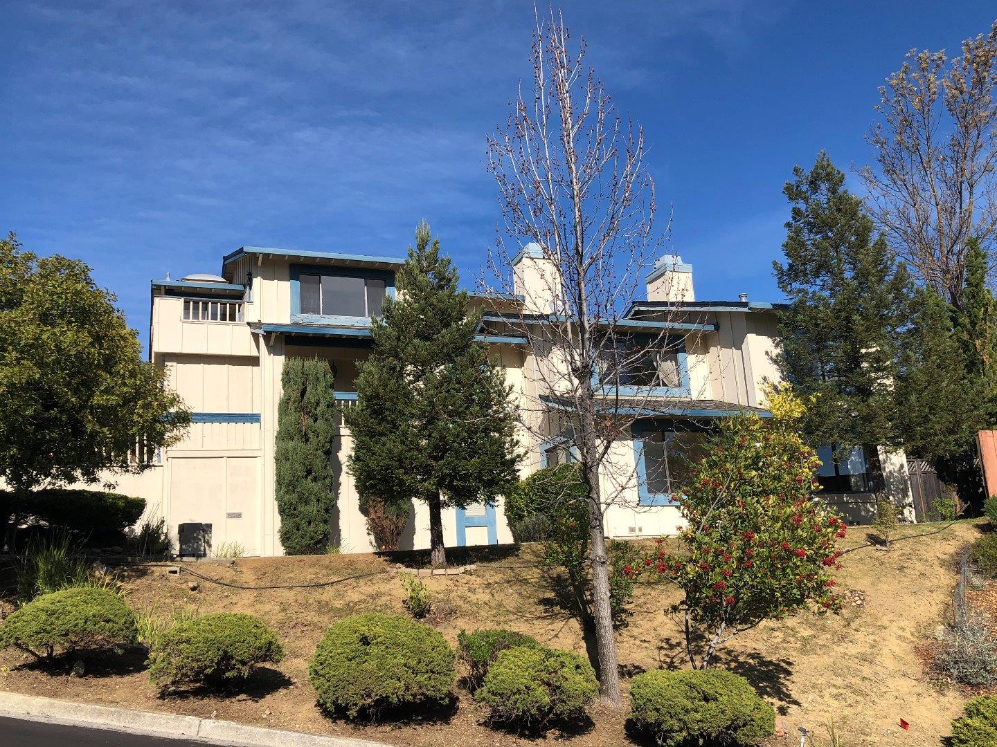23025 Voss Avenue Cupertino, CA 95014 - Photo 4 of 45 a front view of a house with a yard