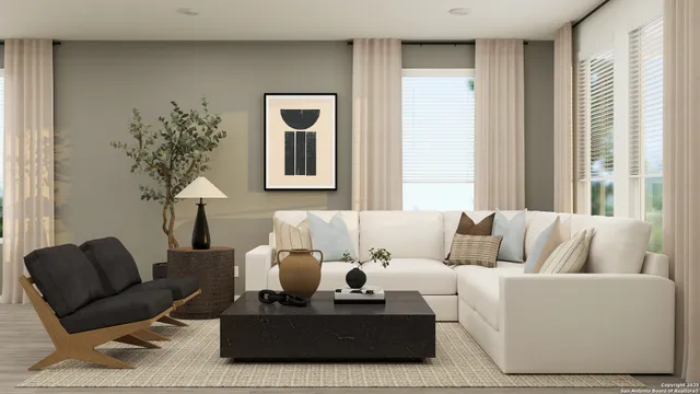 a living room with furniture and a potted plant