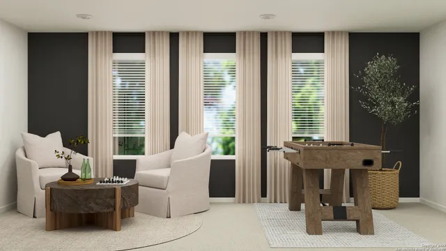 a view of entryway with workspace and livingroom view