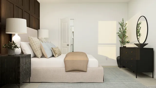 a bedroom with a bed and a lamp