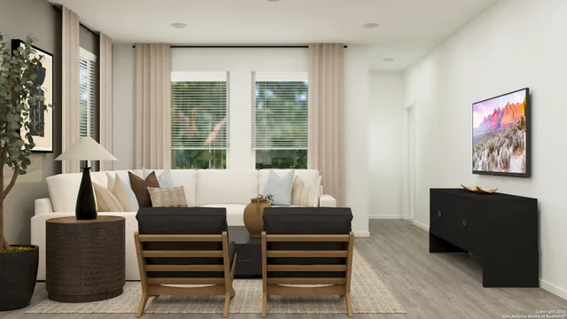 a living room with furniture a large window and flat screen tv