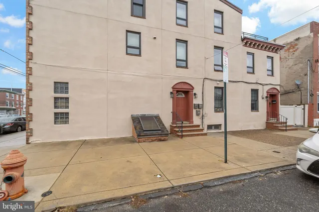 a view of a street with parking