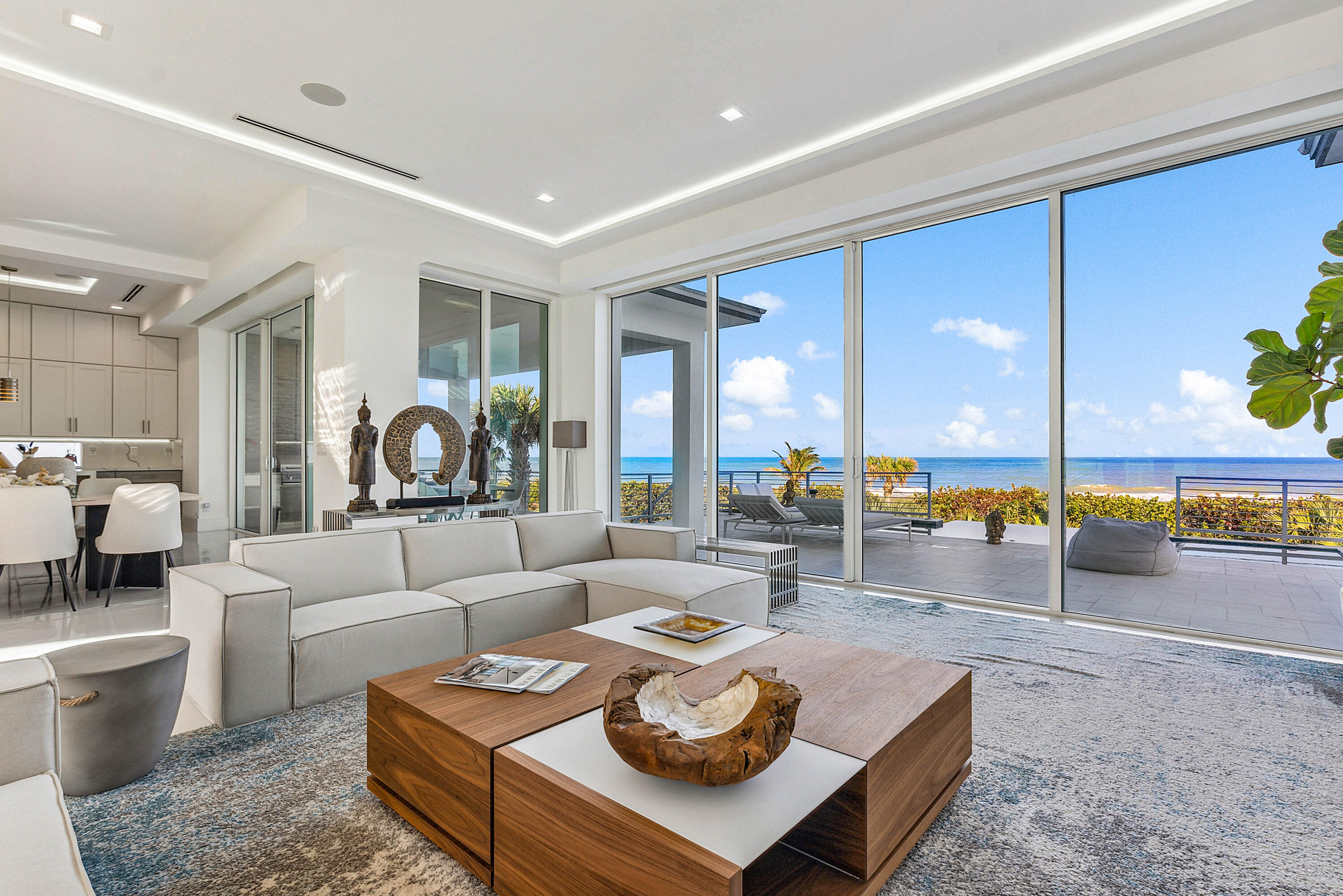 4422 North Hwy A1A Hutchinson Island, FL 34949 - Photo 12 of 86 a living room with furniture and a large window