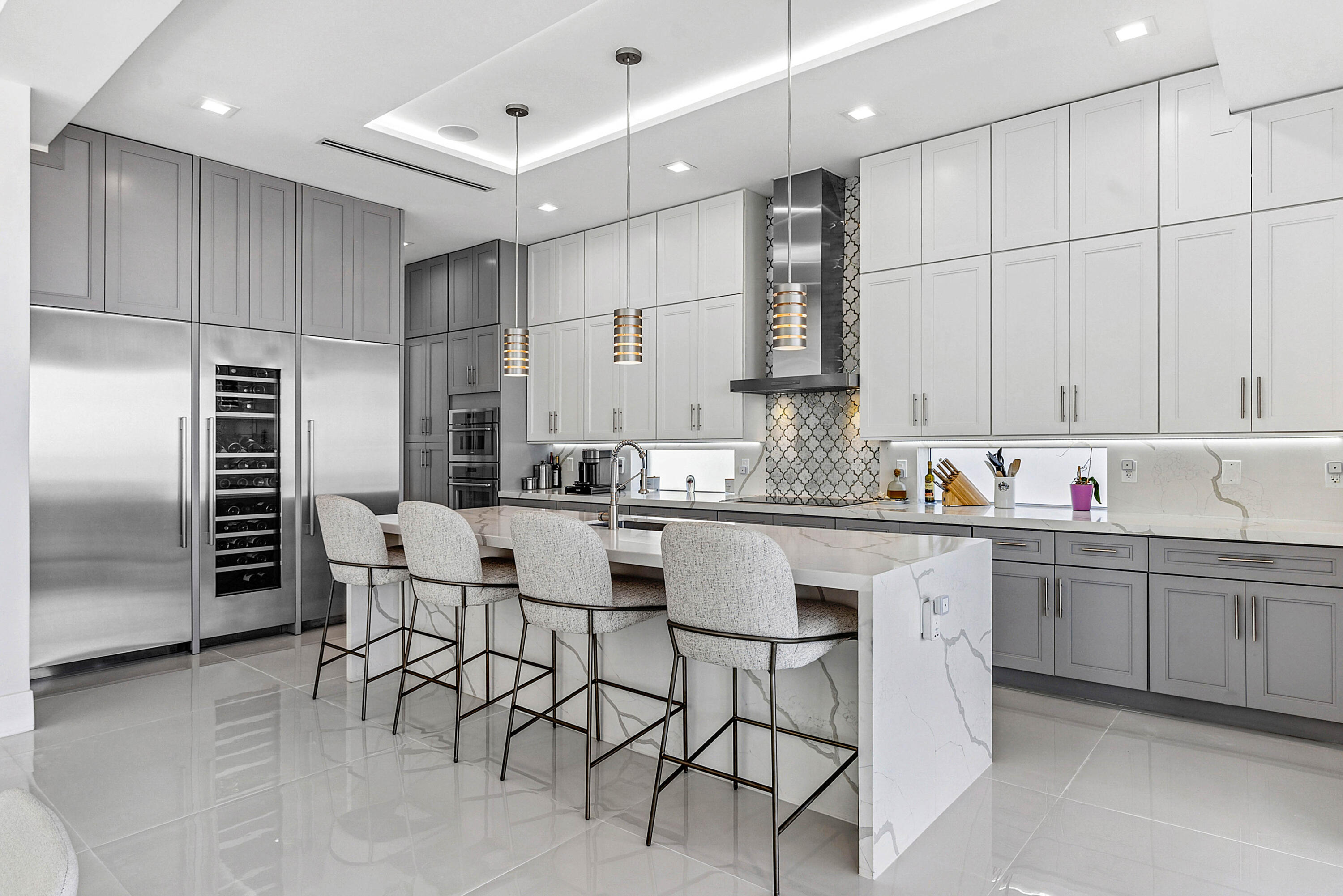 4422 North Hwy A1A Hutchinson Island, FL 34949 - Photo 17 of 86 a kitchen with stainless steel appliances kitchen island granite countertop a sink and cabinets