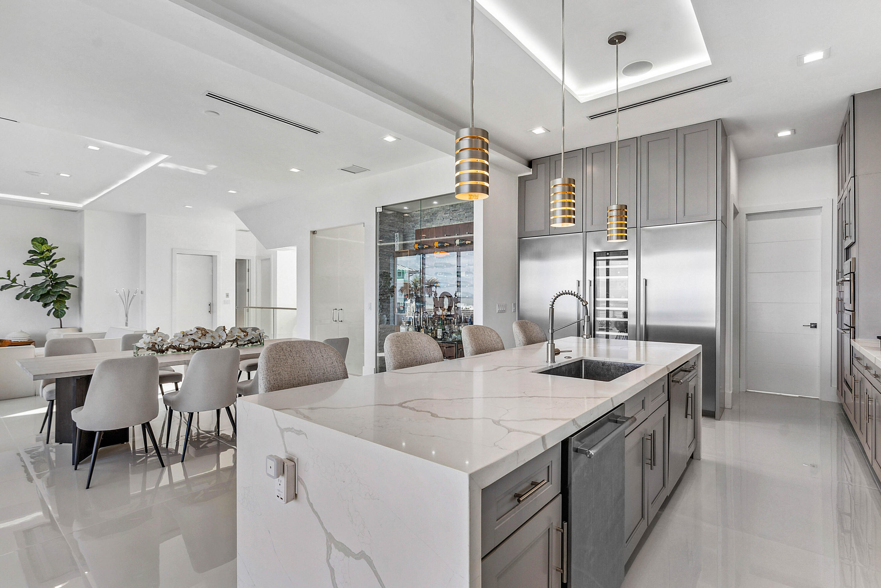 4422 North Hwy A1A Hutchinson Island, FL 34949 - Photo 18 of 86 a kitchen with center island table and chairs