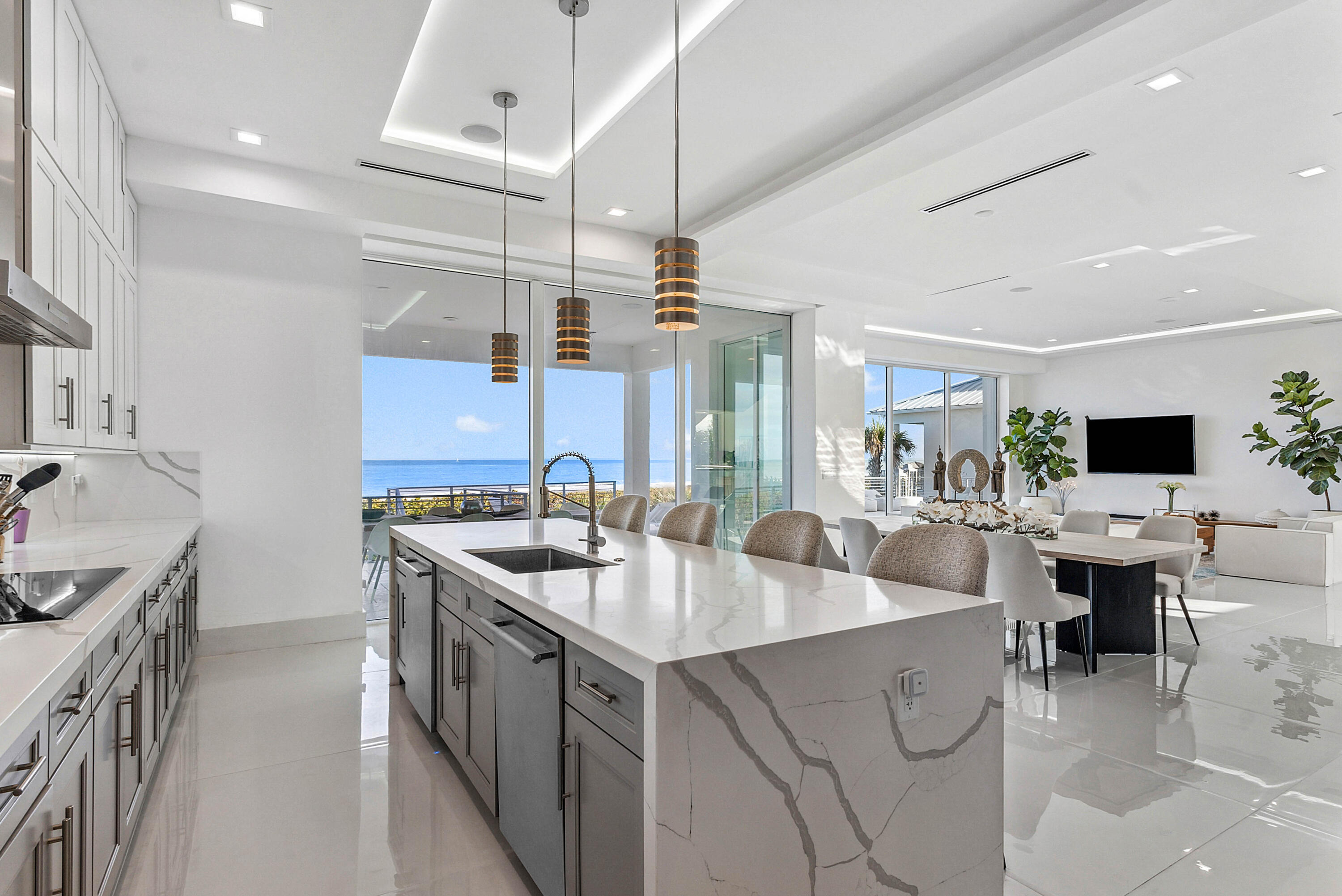 4422 North Hwy A1A Hutchinson Island, FL 34949 - Photo 19 of 86 a kitchen with stainless steel appliances granite countertop a sink a stove and a refrigerator