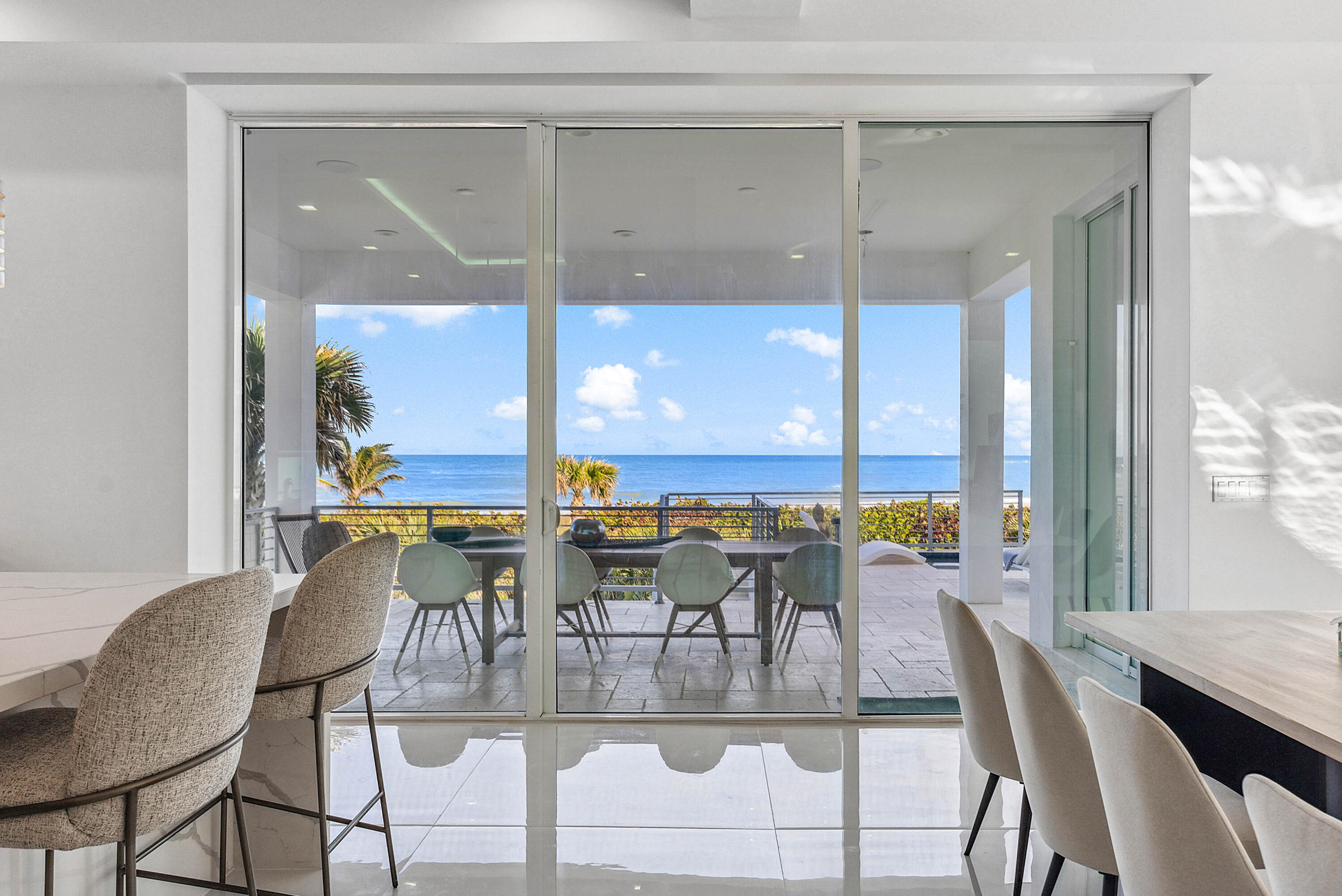 4422 North Hwy A1A Hutchinson Island, FL 34949 - Photo 21 of 86 a view of a dining room with furniture window and outside view