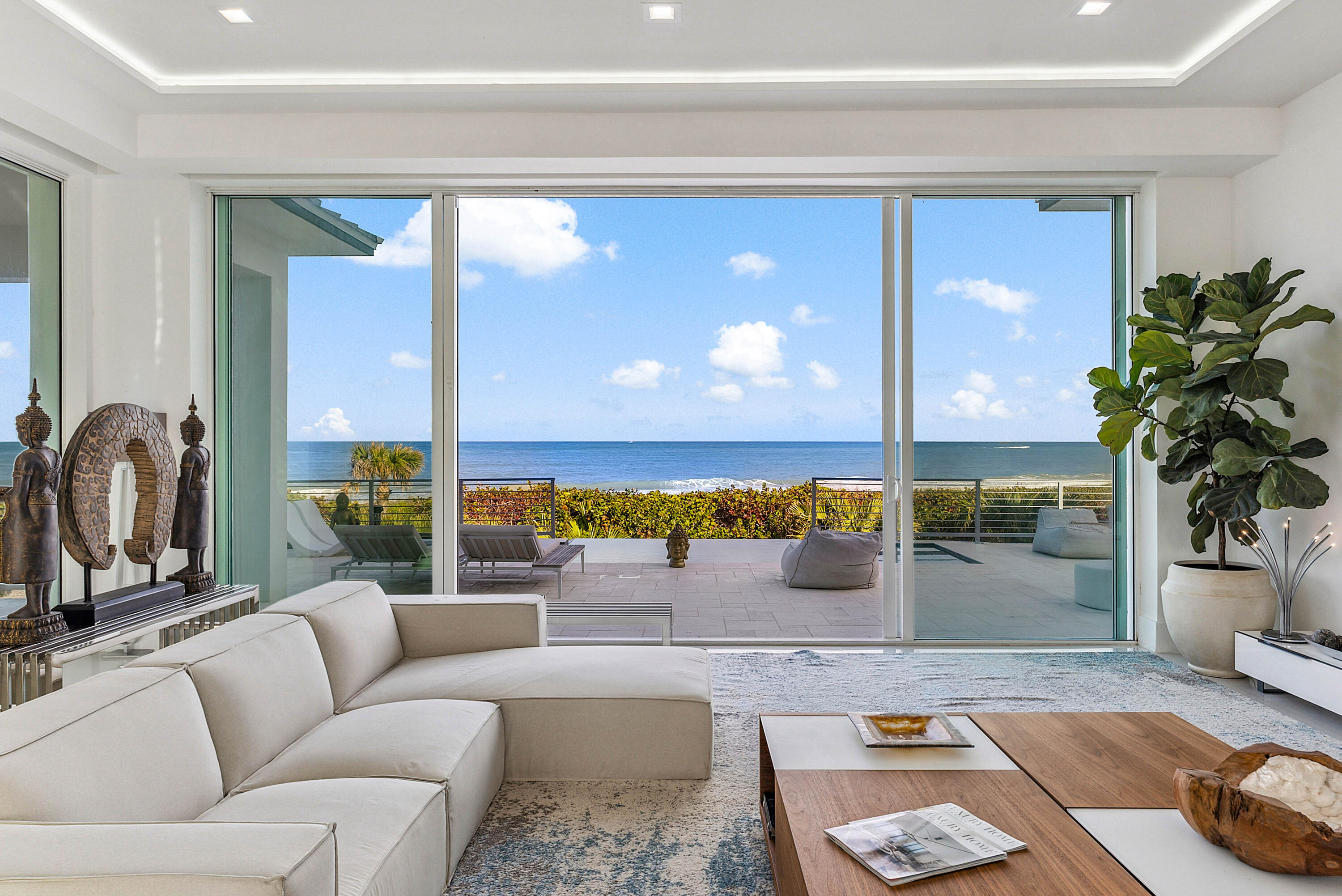 4422 North Hwy A1A Hutchinson Island, FL 34949 - Photo 25 of 86 a living room with furniture and a potted plant