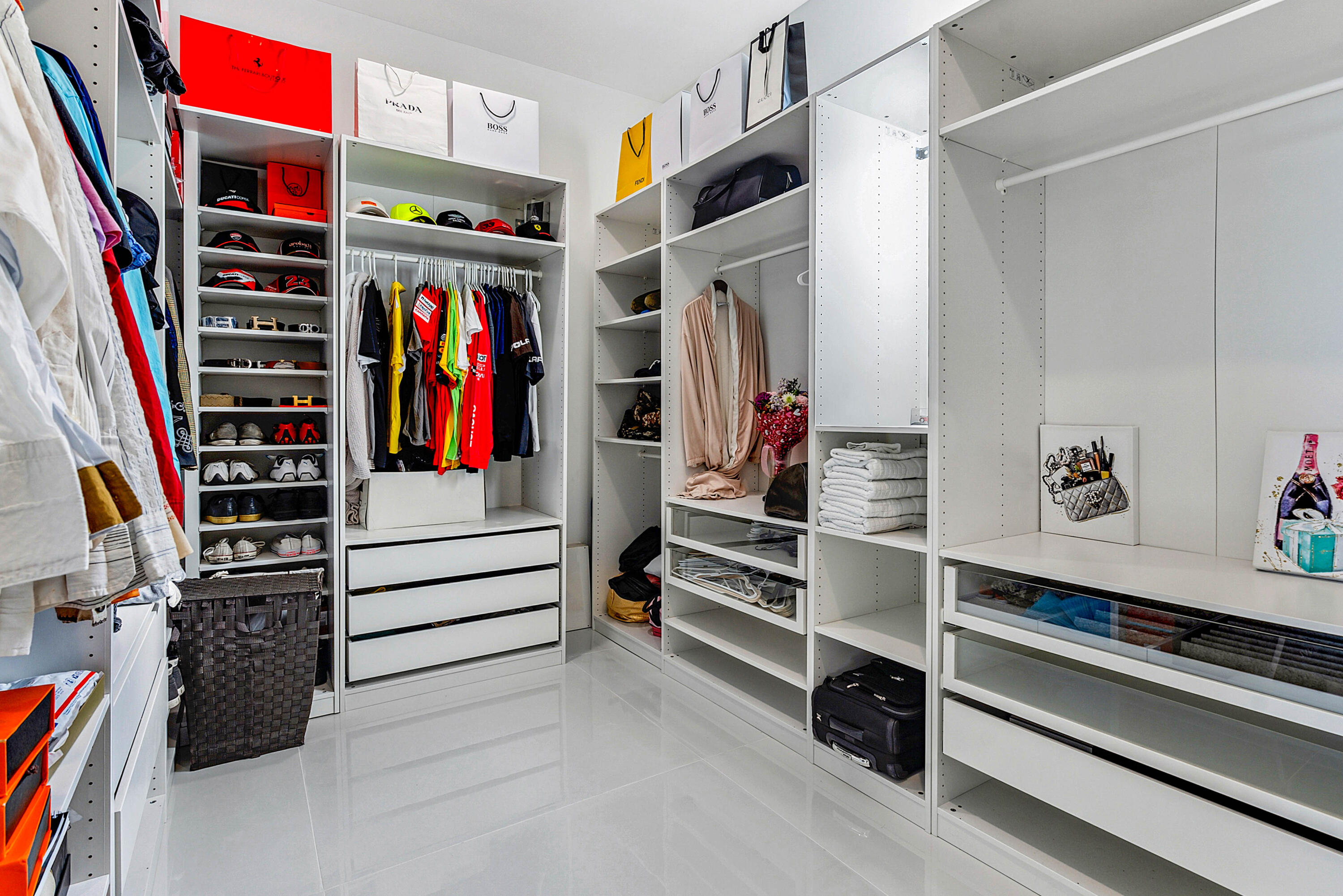 4422 North Hwy A1A Hutchinson Island, FL 34949 - Photo 26 of 86 a view of walk in closet with clothes and shoes