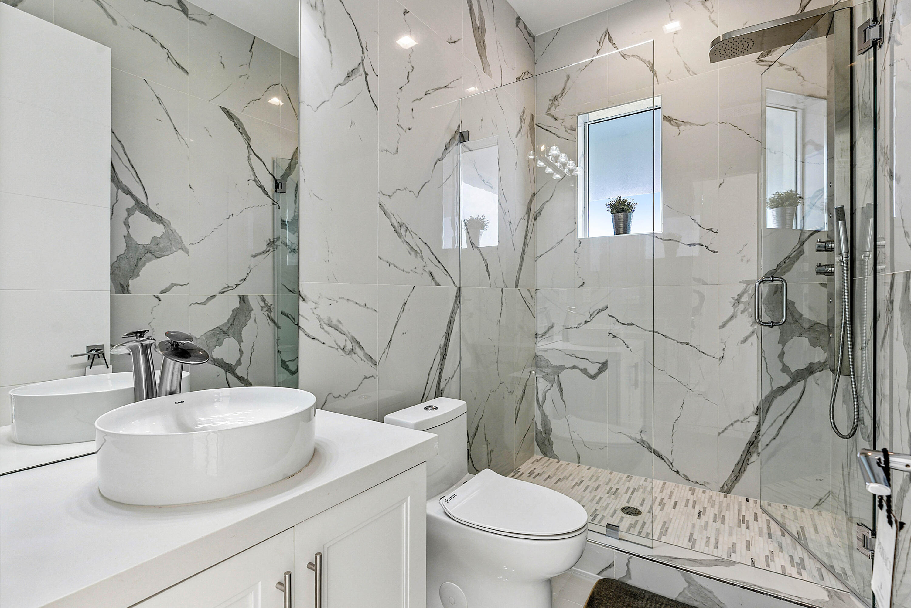 4422 North Hwy A1A Hutchinson Island, FL 34949 - Photo 36 of 86 a bathroom with a sink toilet and shower