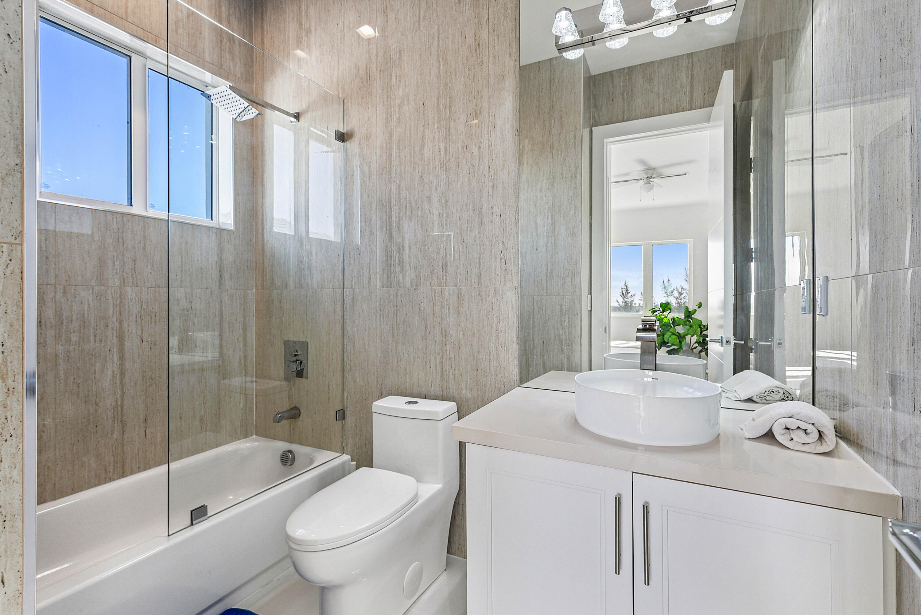 4422 North Hwy A1A Hutchinson Island, FL 34949 - Photo 39 of 86 a bathroom with a sink a toilet and shower