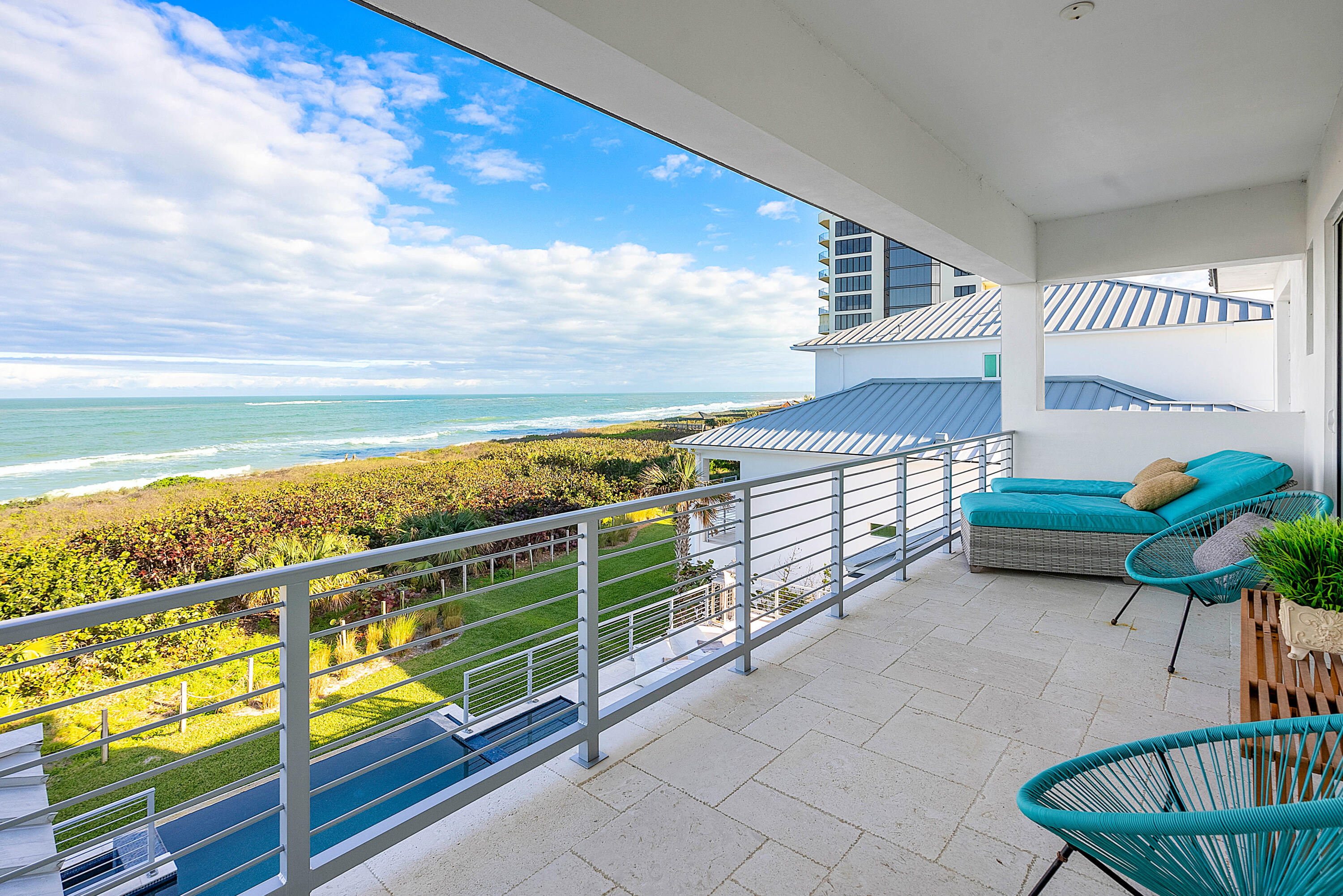 4422 North Hwy A1A Hutchinson Island, FL 34949 - Photo 43 of 86 a view of a chairs and table in the balcony